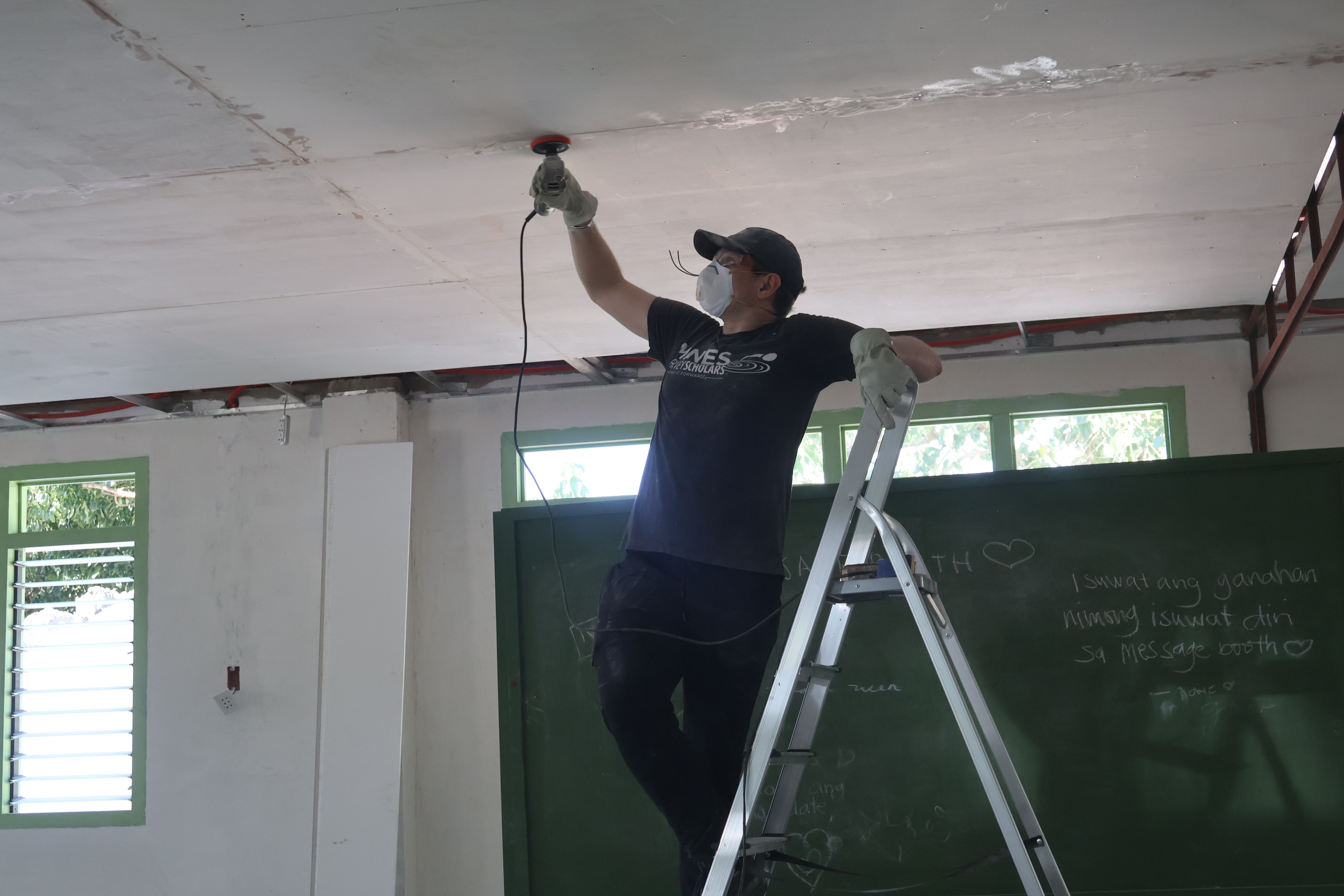 Sanding down the putty to be smooth